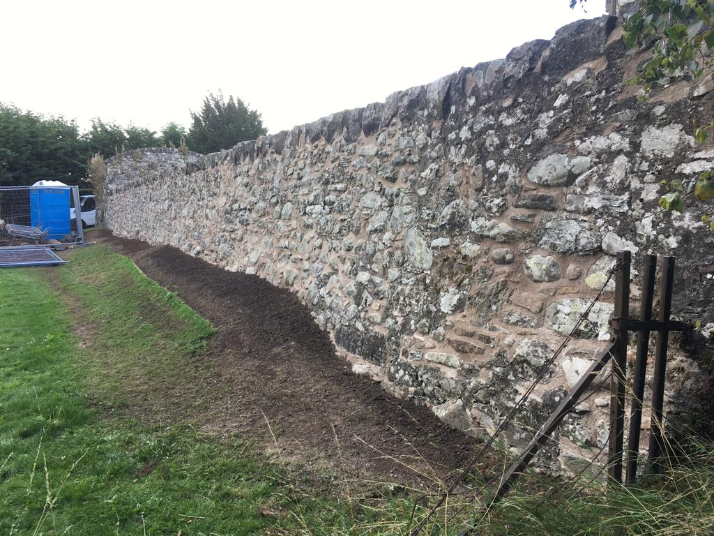 Long garden stone wall